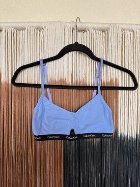 Baby blue Calvin Klein bralette with small cut out and adjustable straps